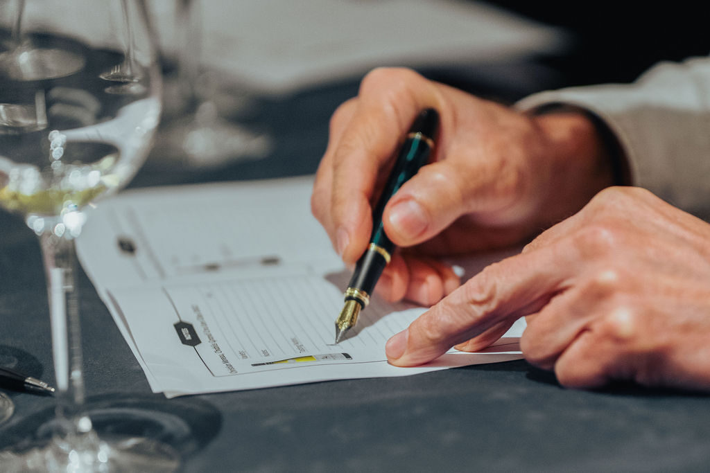 Signing detail at a brand event photographed by George Koumas